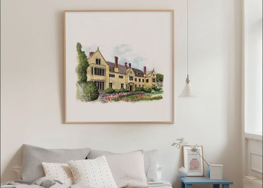 Framed artwork of a house on a wall in a living room.