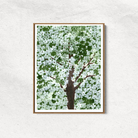 Framed artwork of a tree with green leaves and a brown trunk on a light gray background
