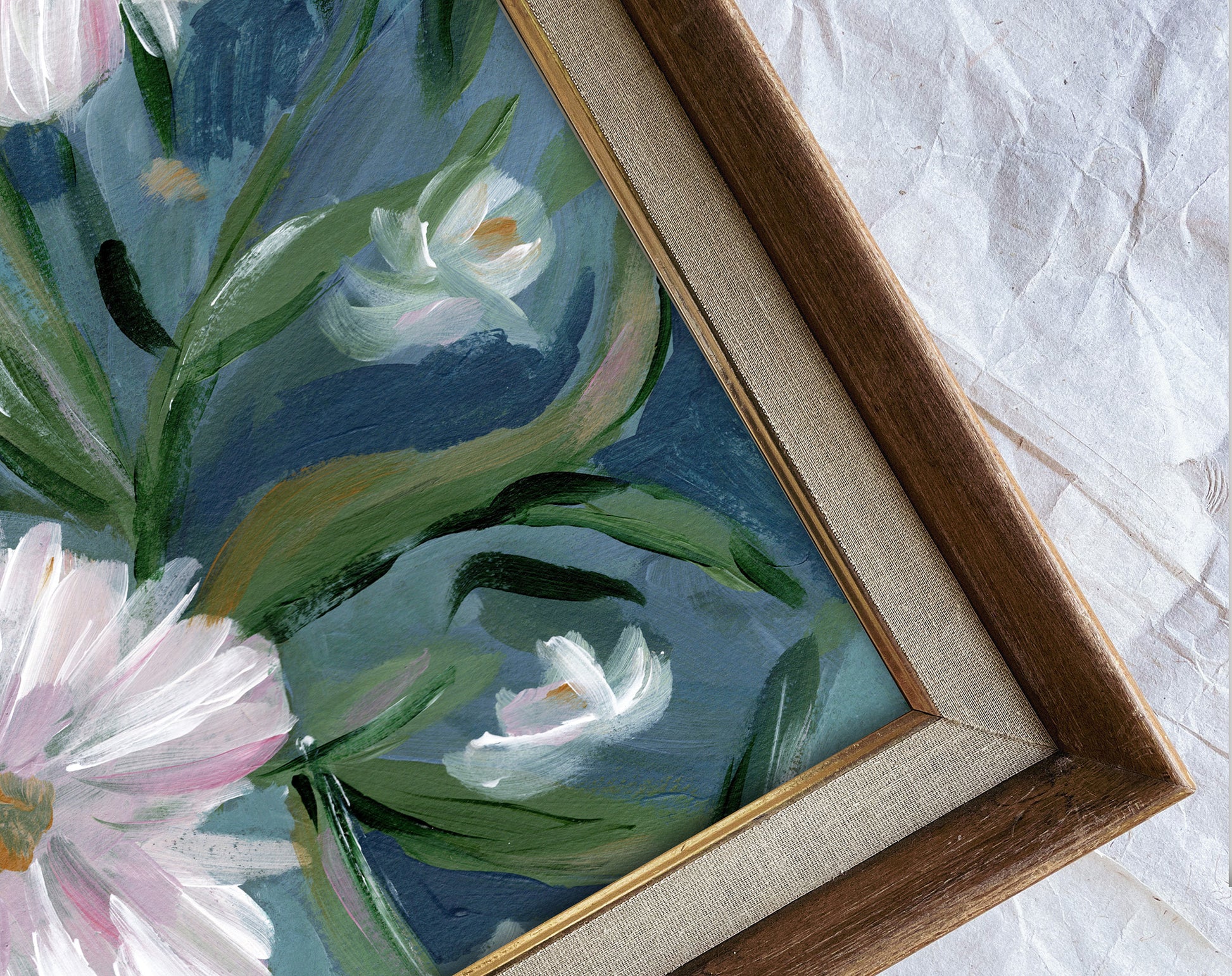 Framed painting of flowers on a textured white background