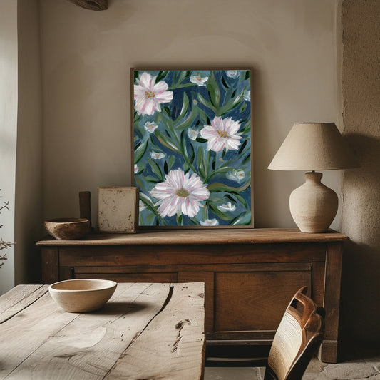 Floral painting on a wall above a wooden console table with a lamp and decorative items.
