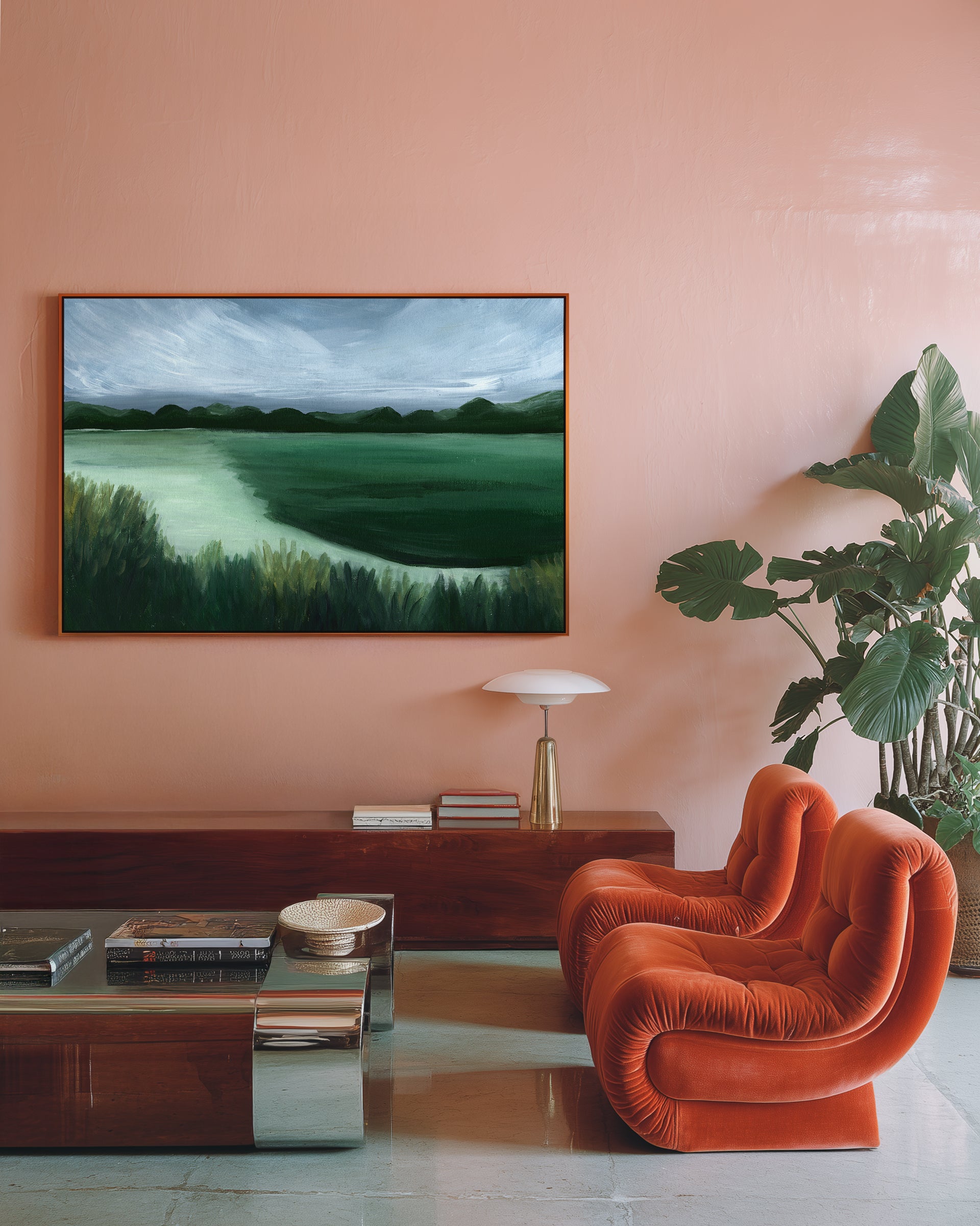 Modern living room with a painting on the wall, orange chair, and decorative items.
